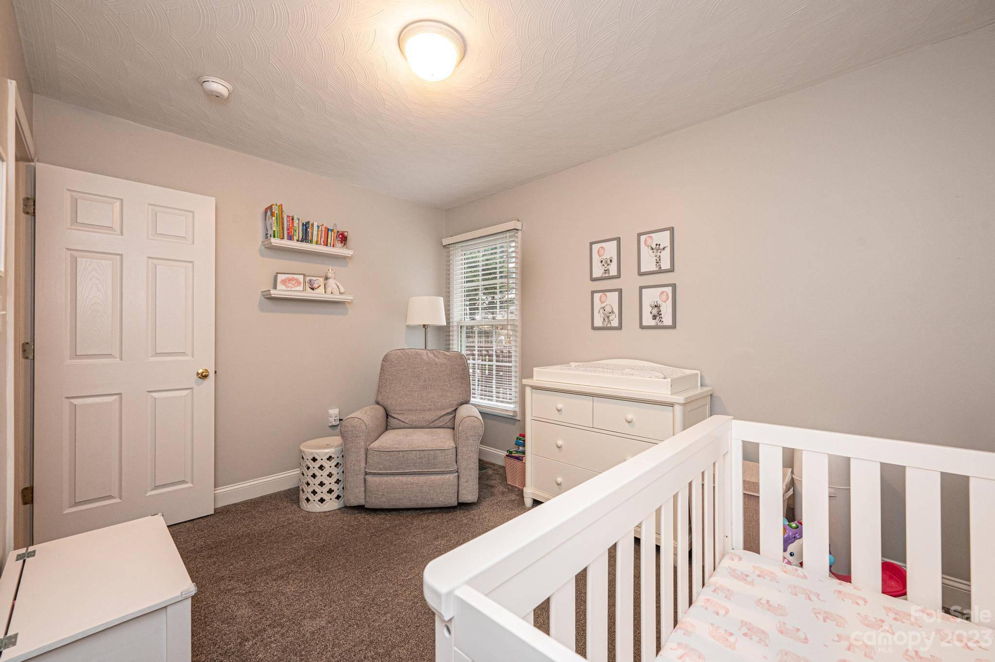 4875 Water Wheel Drive Conover, NC 28613 - Photo 21 of 33 a bedroom with furniture and a wooden floor