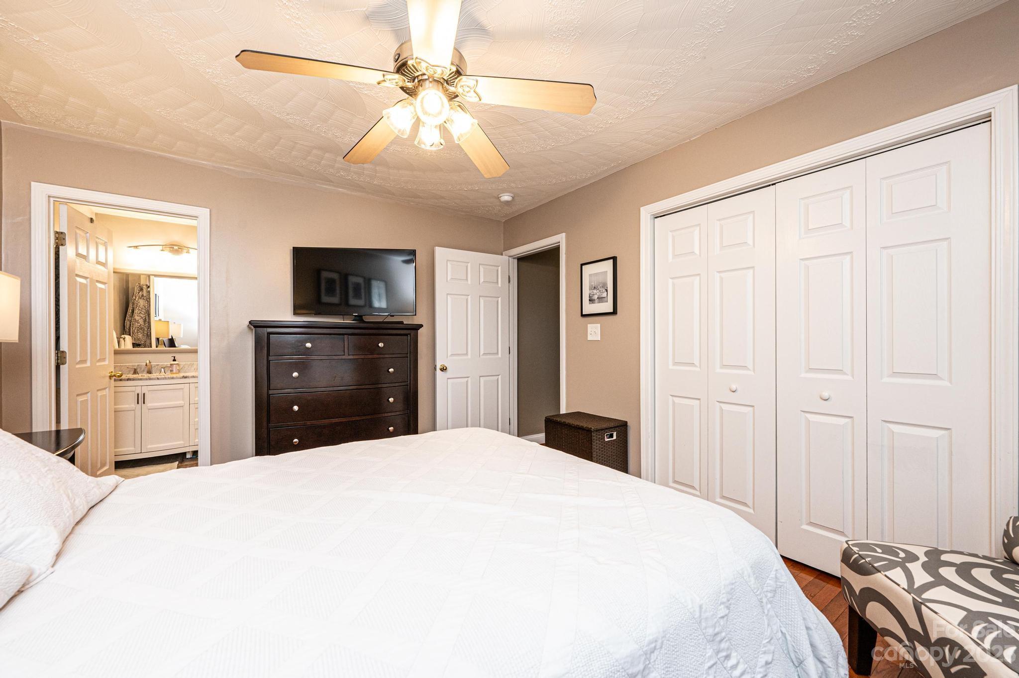 4875 Water Wheel Drive Conover, NC 28613 - Photo 25 of 33 a bedroom with a bed and a chandelier