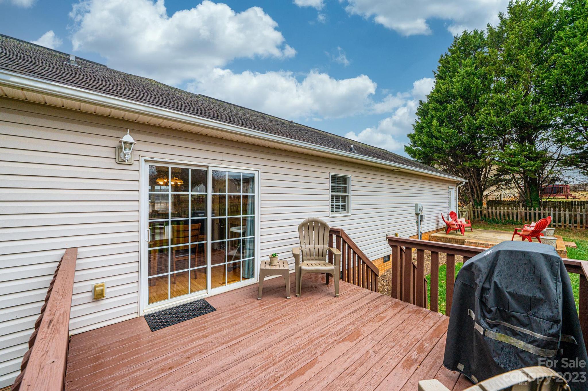 4875 Water Wheel Drive Conover, NC 28613 - Photo 32 of 33 a view of a deck with table and chairs and wooden floor