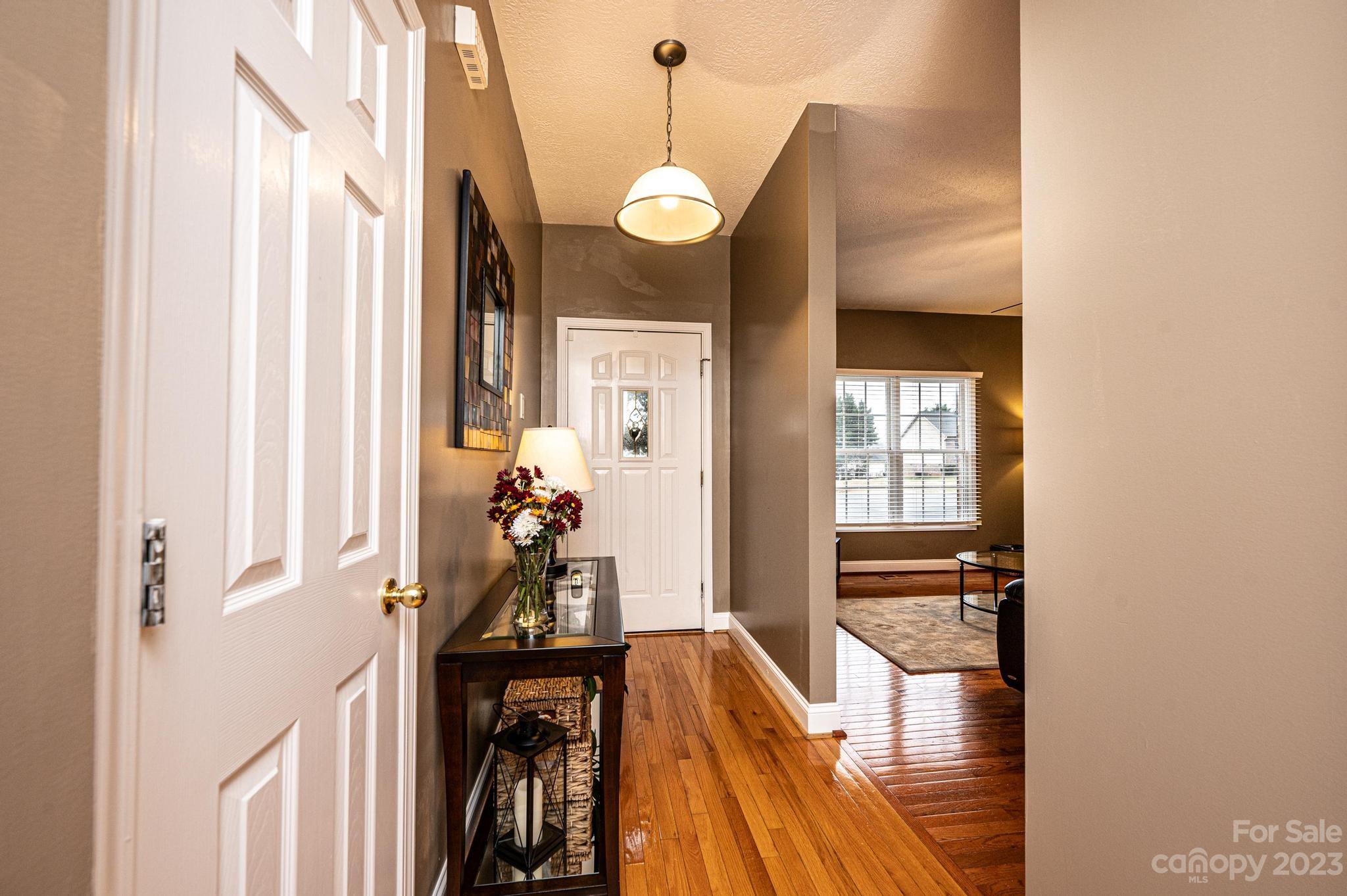4875 Water Wheel Drive Conover, NC 28613 - Photo 4 of 33 a view of entryway and hall with wooden floor