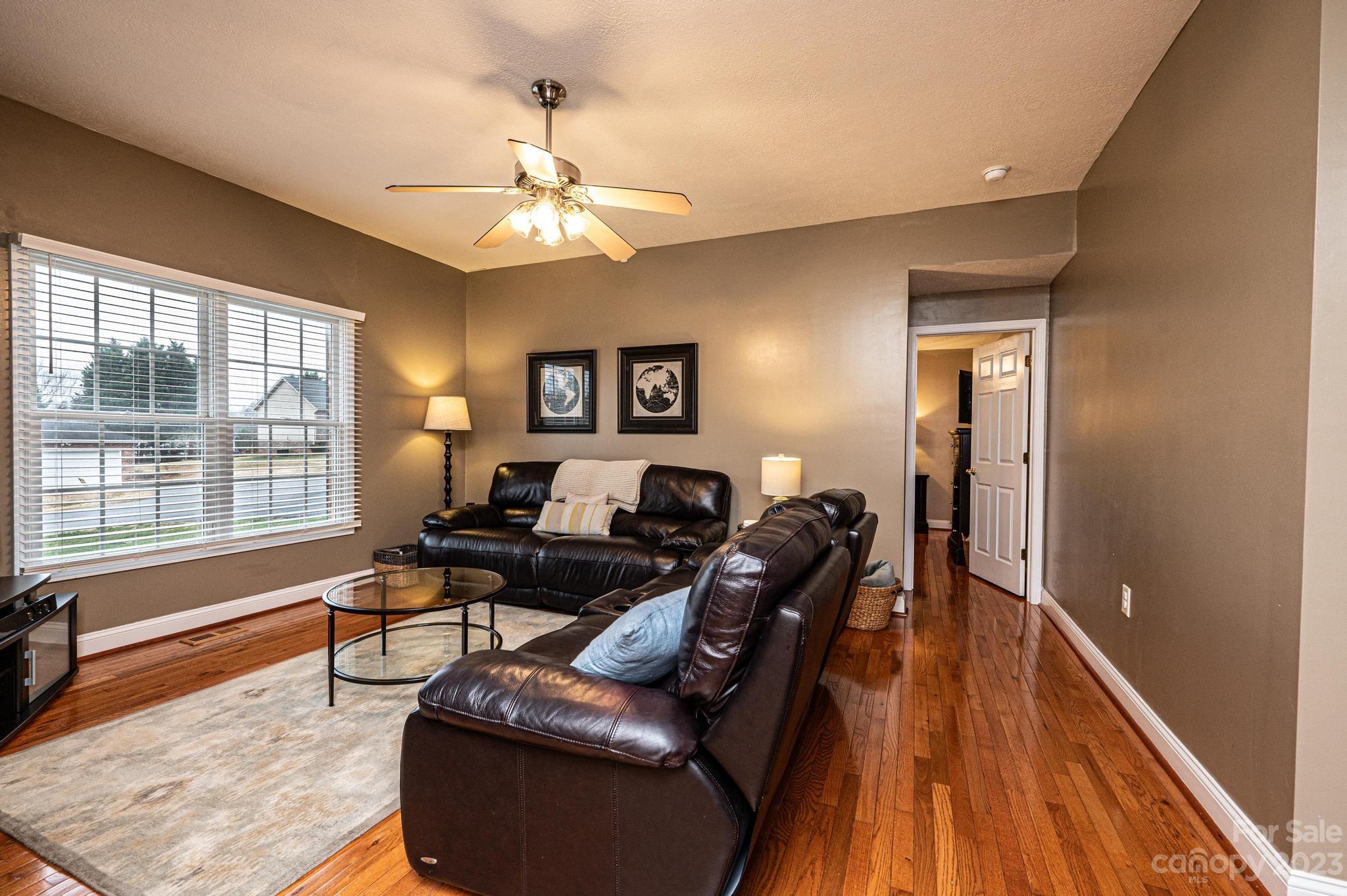 4875 Water Wheel Drive Conover, NC 28613 - Photo 5 of 33 a living room with furniture and a wooden floor