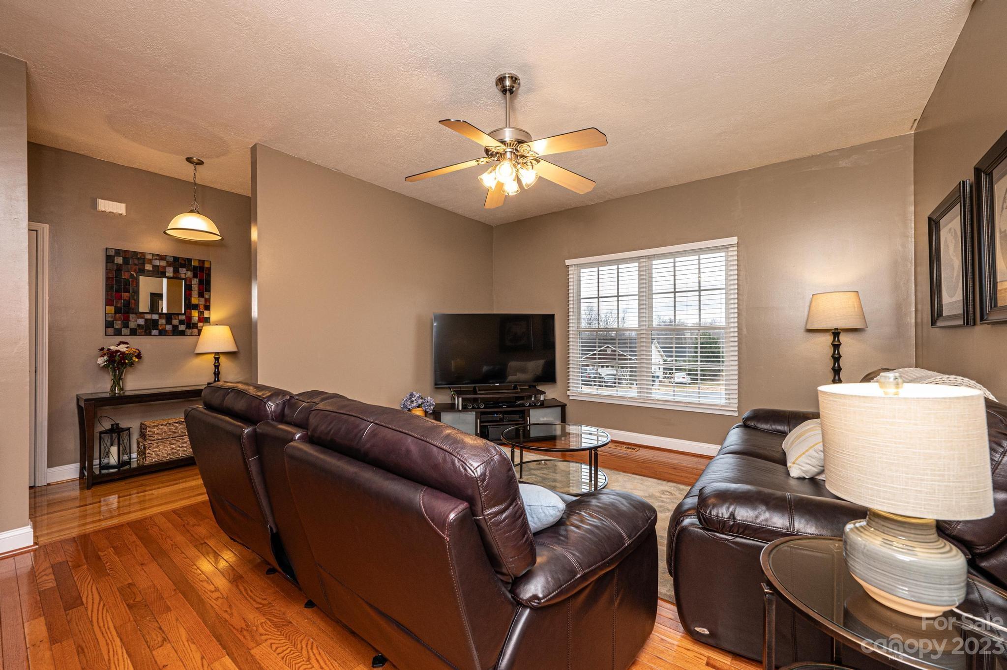 4875 Water Wheel Drive Conover, NC 28613 - Photo 7 of 33 a living room with furniture and a flat screen tv