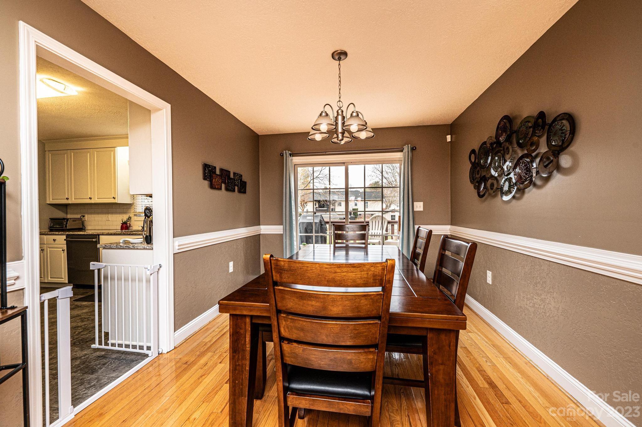 4875 Water Wheel Drive Conover, NC 28613 - Photo 8 of 33 a view of a dining room with furniture window and wooden floor