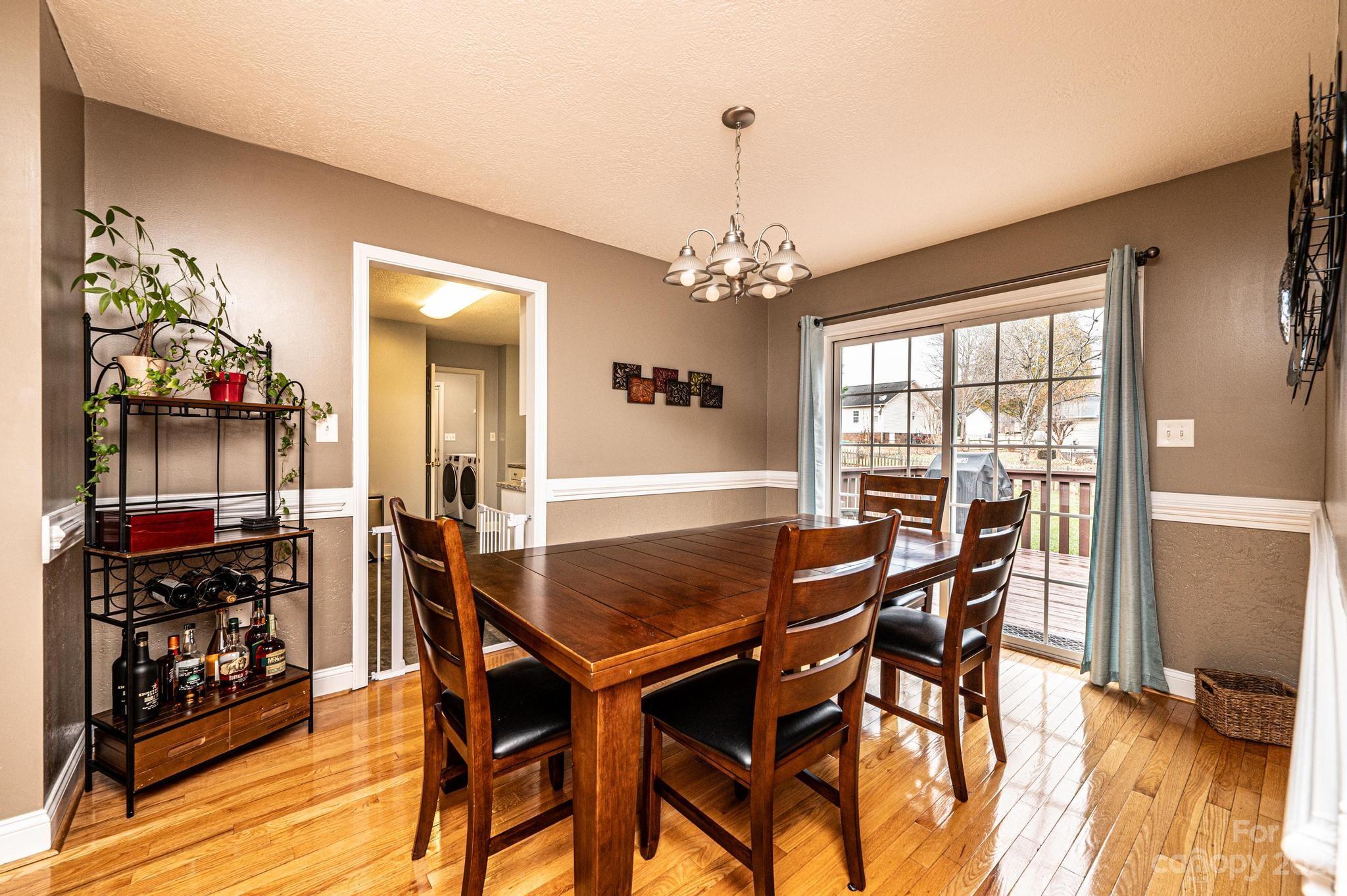 4875 Water Wheel Drive Conover, NC 28613 - Photo 9 of 33 a view of a dining room with furniture and wooden floor