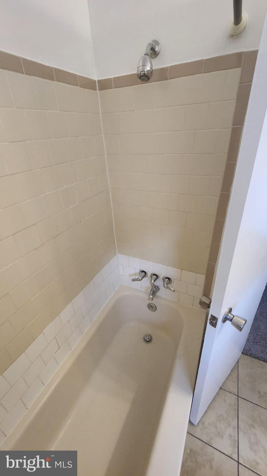 3914 28th Avenue Temple Hills, MD 20748 - Photo 11 of 28 a bathroom with a bathtub