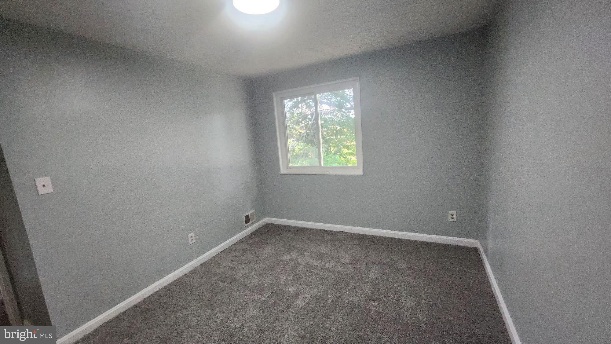 3914 28th Avenue Temple Hills, MD 20748 - Photo 13 of 28 an empty room with windows