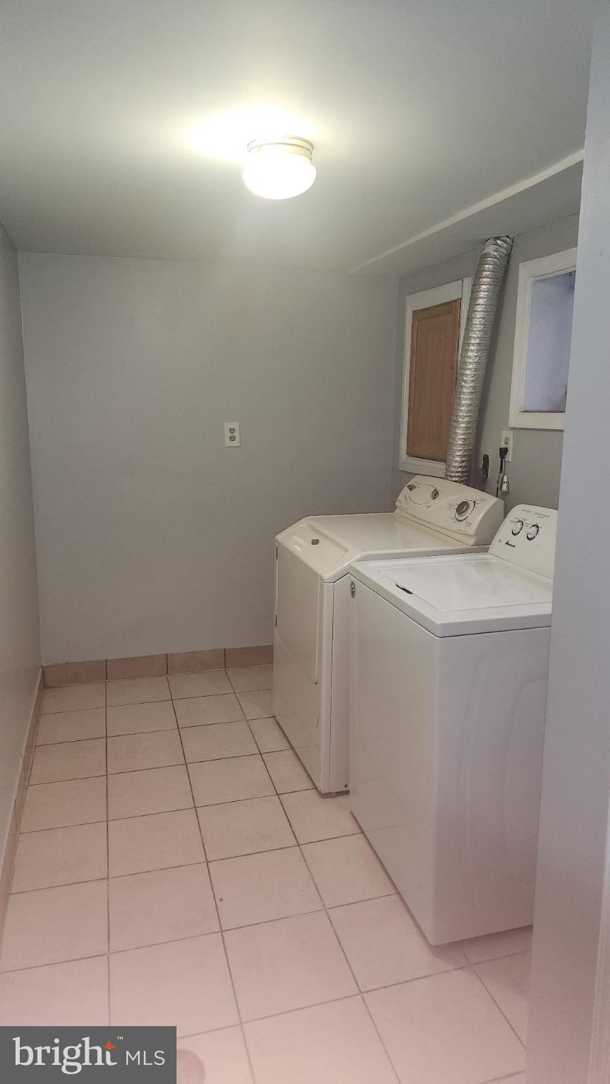 3914 28th Avenue Temple Hills, MD 20748 - Photo 16 of 28 a utility room with dryer and washer