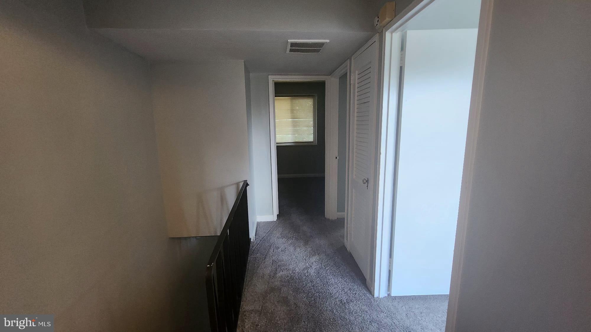 3914 28th Avenue Temple Hills, MD 20748 - Photo 17 of 28 a view of a hallway with closet and wooden floor