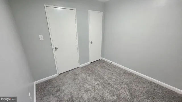 a view of hallway with wooden floor