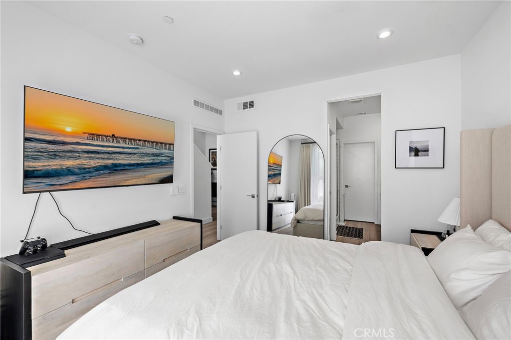 1826 West Bushell Street Anaheim, CA 92805 - Photo 19 of 30 a bedroom with a bed and a flat screen tv
