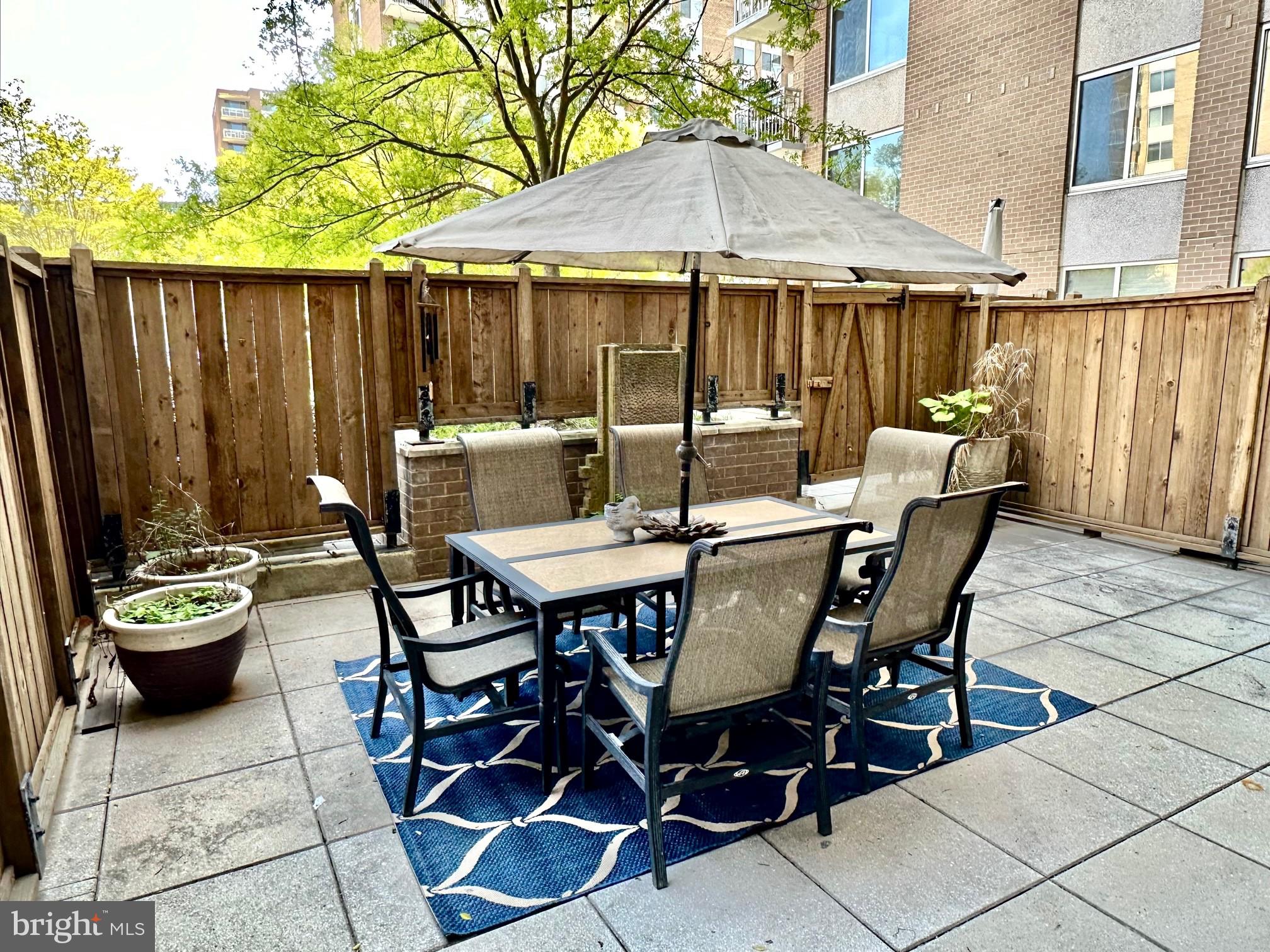 a view of a dinning table and chairs in the patio