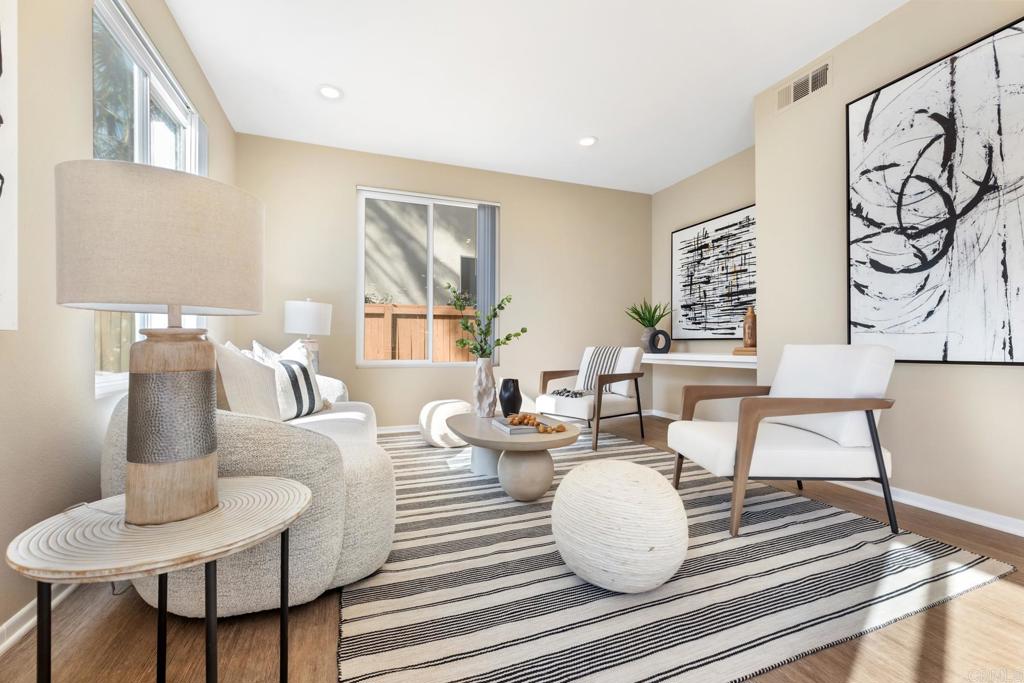 3215 Corte Poco Carlsbad, CA 92009 - Photo 11 of 25 a living room with furniture and a painting
