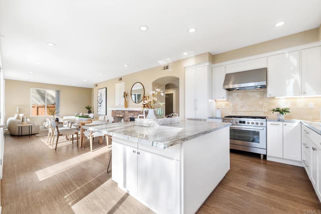 3215 Corte Poco Carlsbad, CA 92009 - Photo 8 of 25 a kitchen with sink stove and cabinets