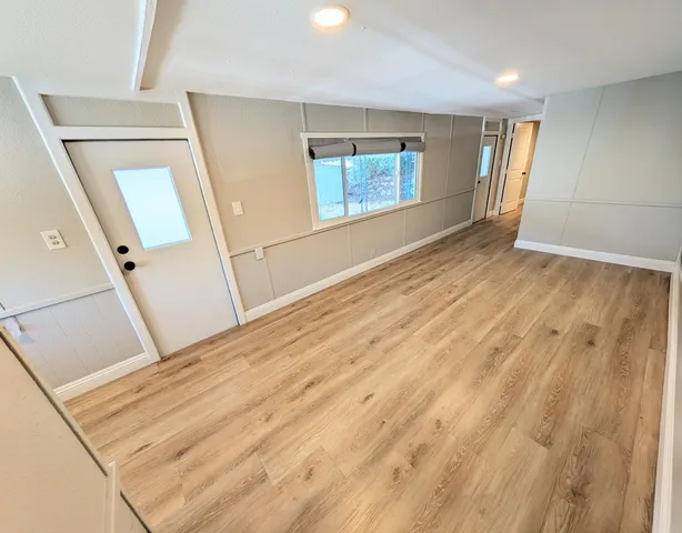 a kitchen with stainless steel appliances a refrigerator sink and stove