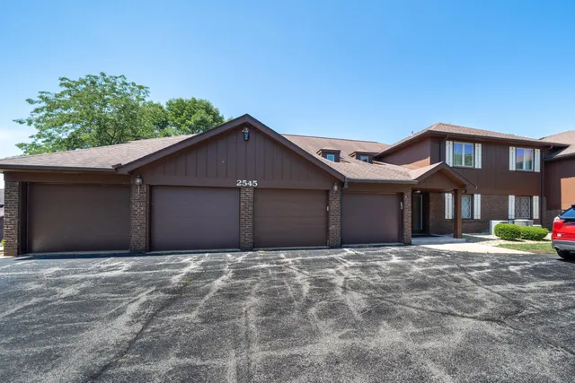 a front view of a house with a garage