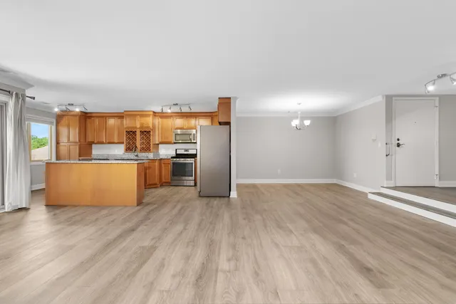 a view of kitchen with wooden floor