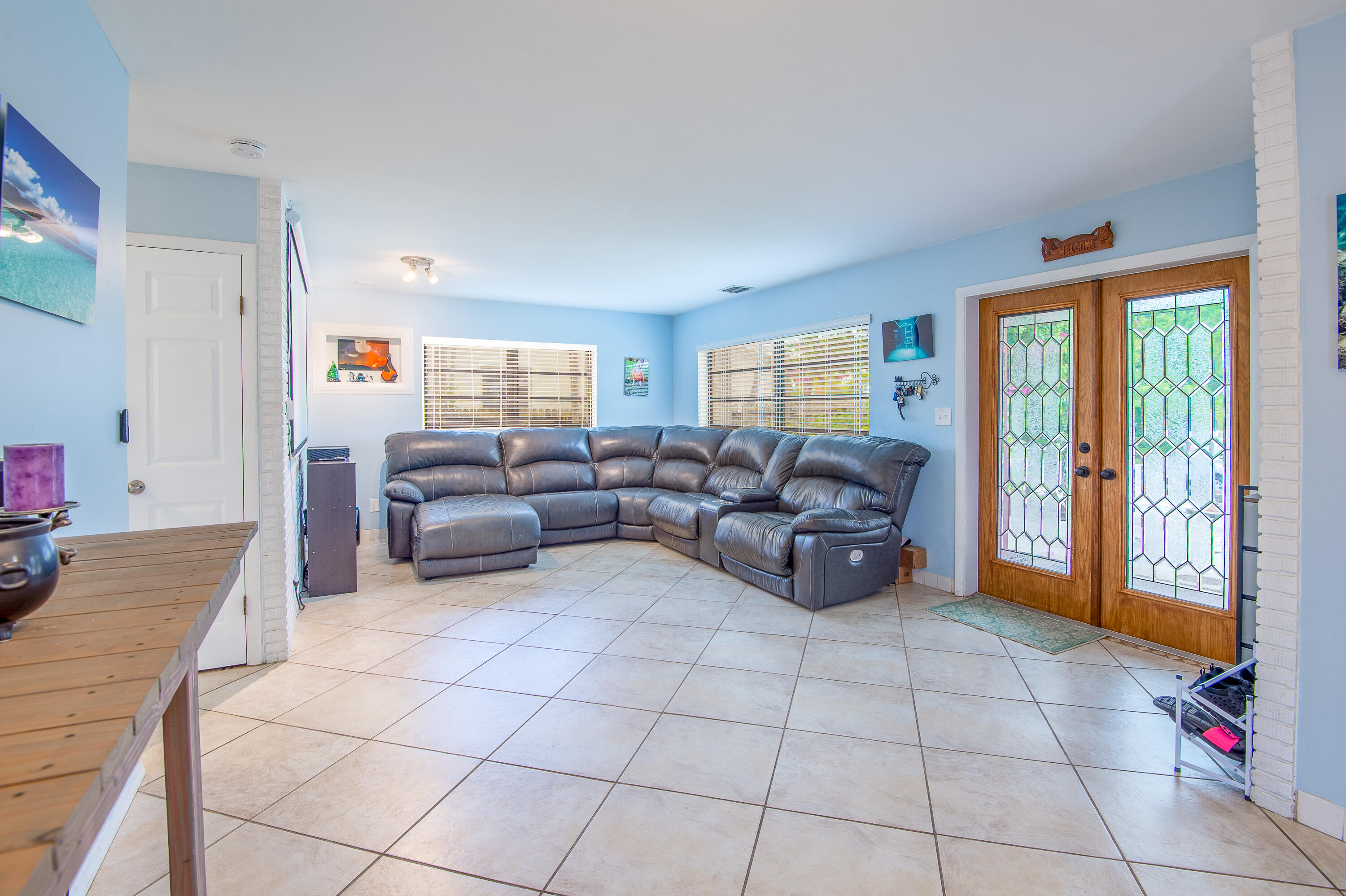 34 Key Haven Road Key West, FL 33040 - Photo 13 of 45 a living room with furniture and large windows
