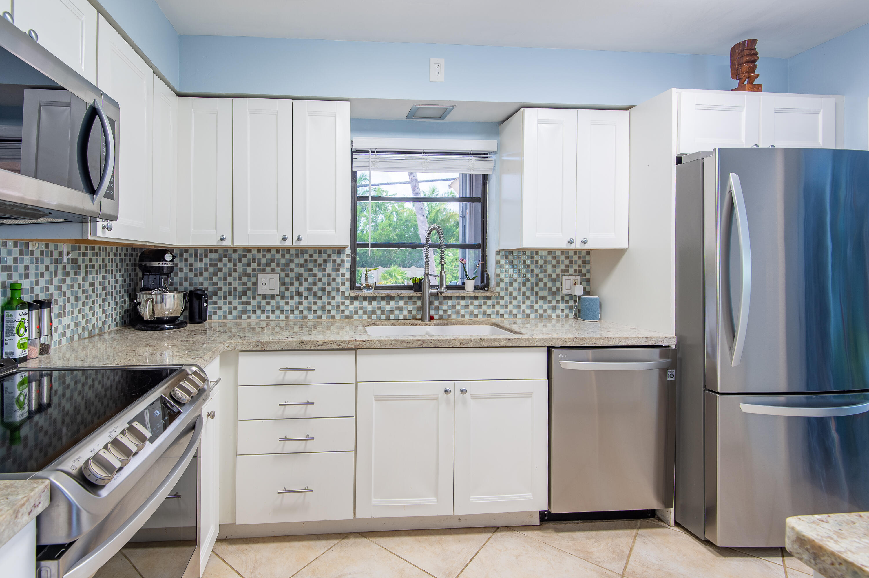 34 Key Haven Road Key West, FL 33040 - Photo 19 of 45 a kitchen with a refrigerator sink and cabinets