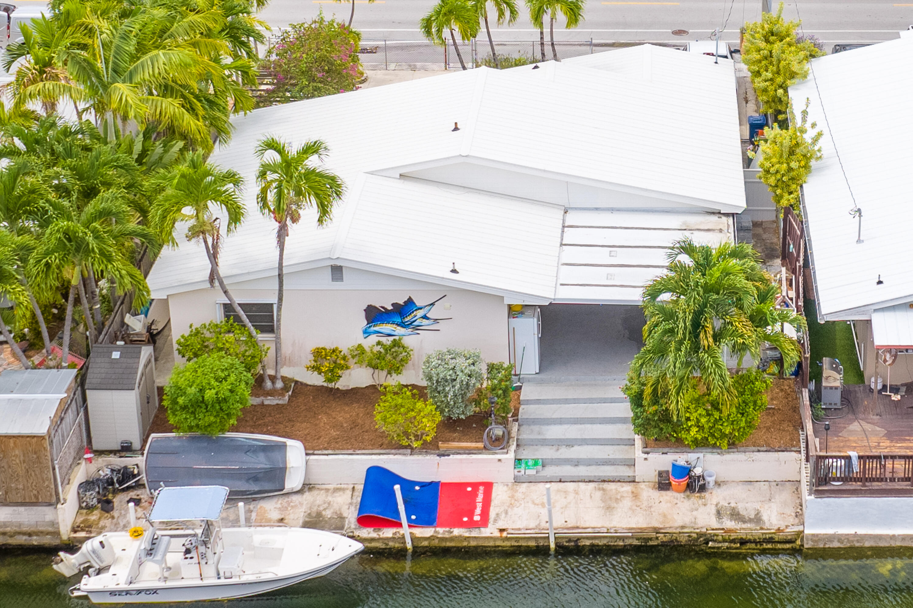 34 Key Haven Road Key West, FL 33040 - Photo 2 of 45 a picture of a patio with table and chairs potted plants