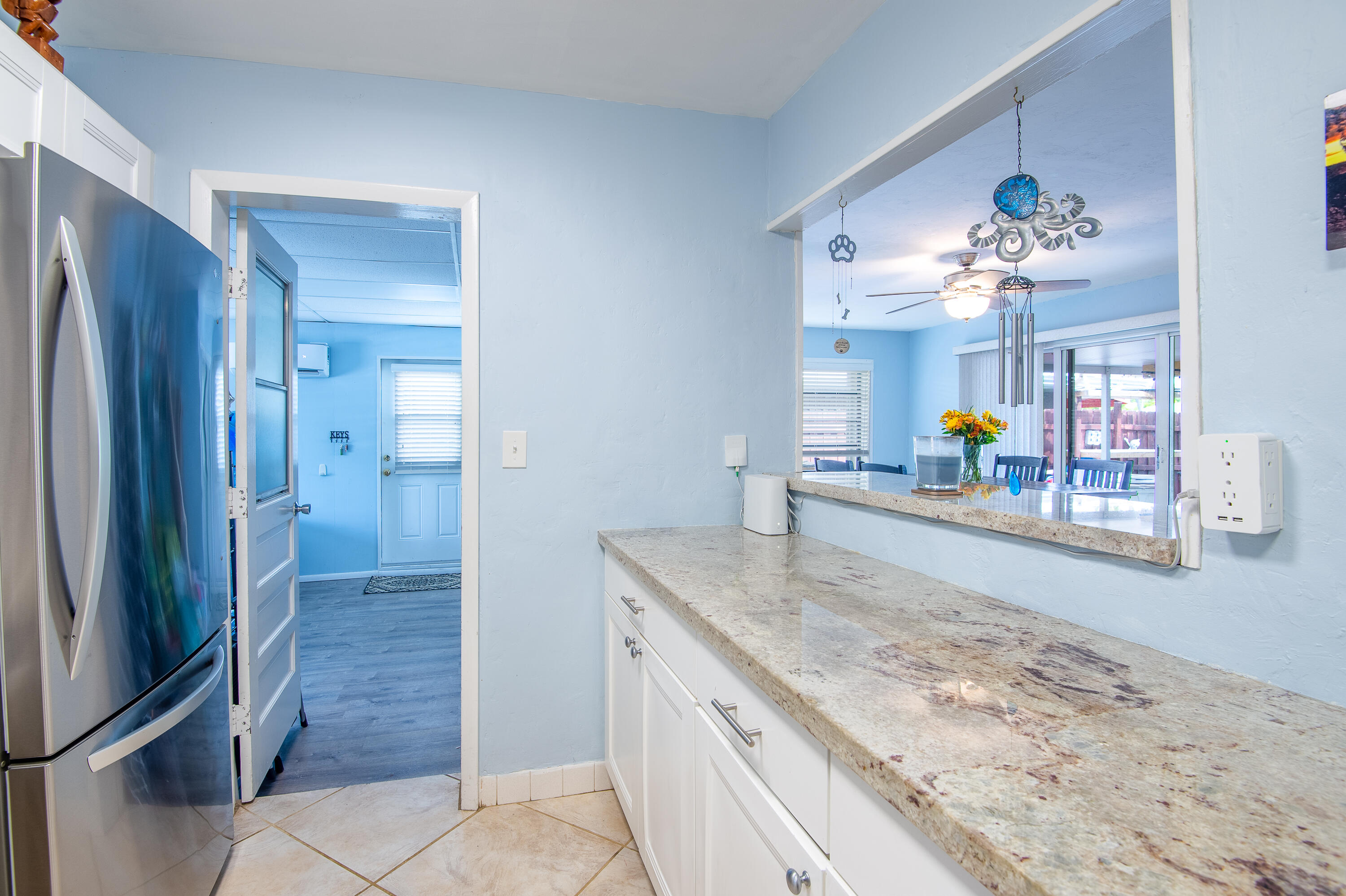 34 Key Haven Road Key West, FL 33040 - Photo 21 of 45 a bathroom with a granite countertop sink a mirror and a shower