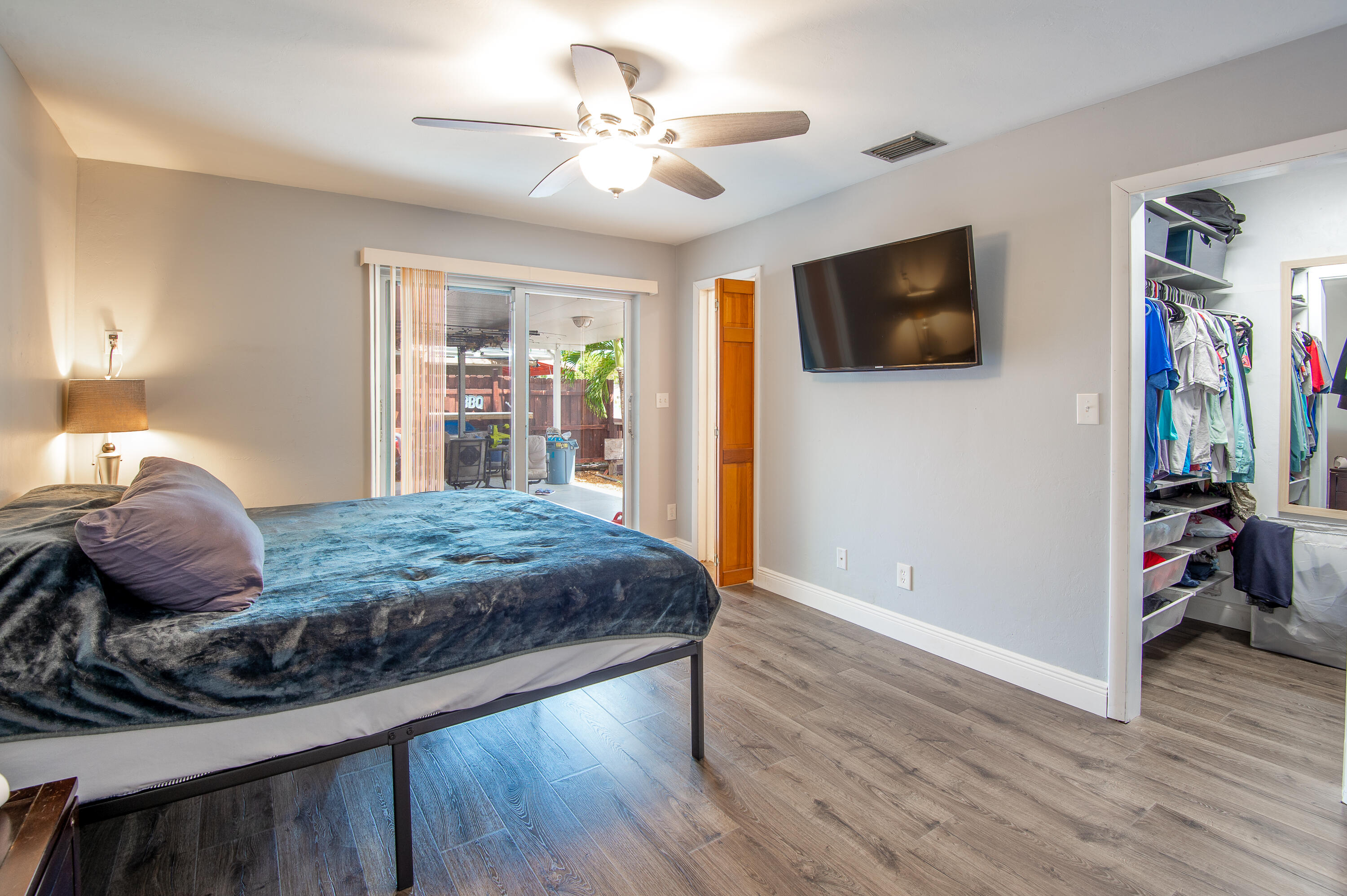 34 Key Haven Road Key West, FL 33040 - Photo 24 of 45 a bedroom with a large bed a flat tv screen and dresser