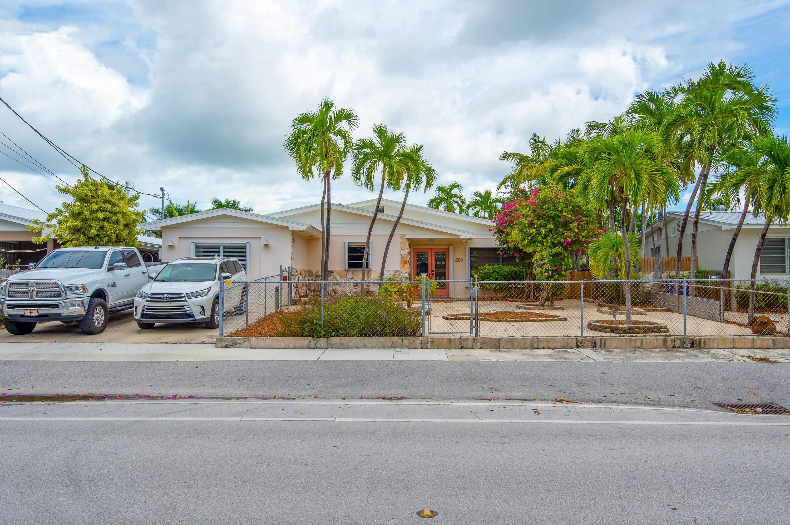 34 Key Haven Road Key West, FL 33040 - Photo 45 of 45 a front view of a house with a garden and outdoor seating