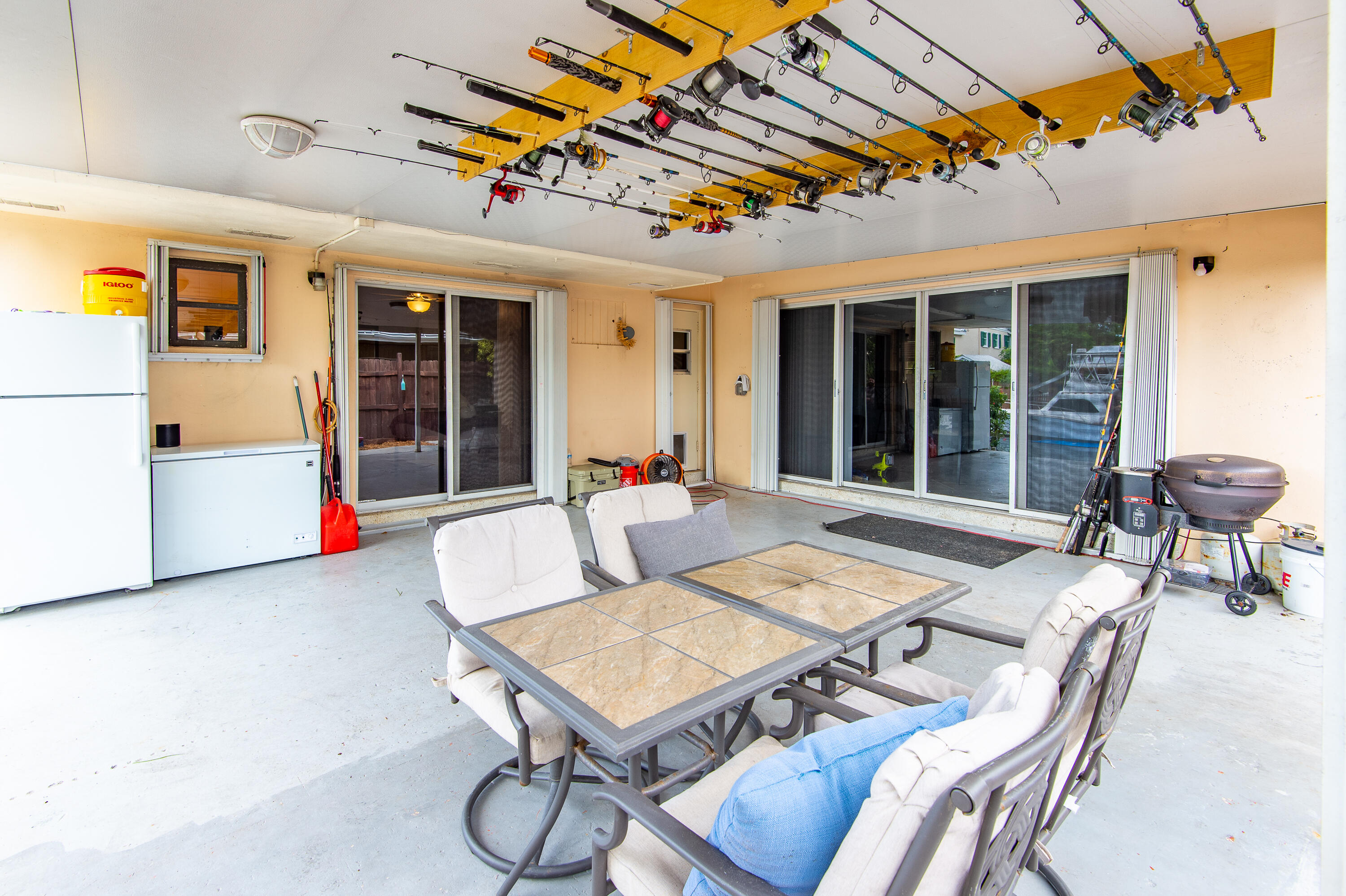 34 Key Haven Road Key West, FL 33040 - Photo 9 of 45 a building outdoor space with patio furniture and potted plants
