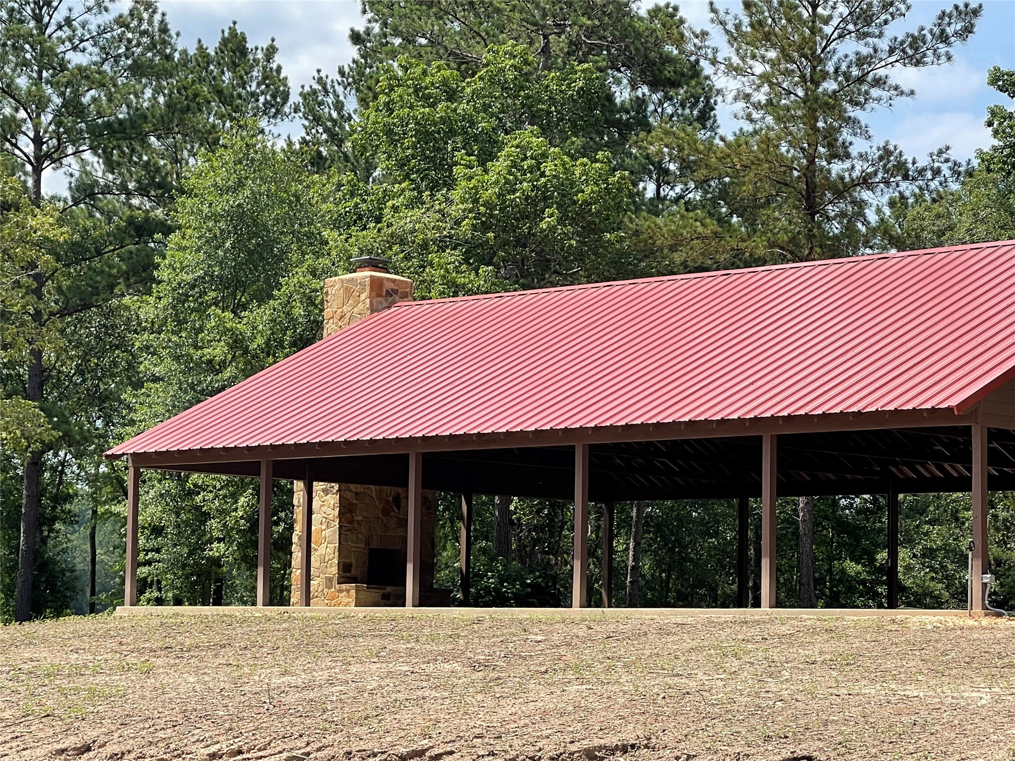 4-a-12-9 Red Hawk Road Huntsville, TX 77340 - Photo 24 of 29 a front view of a house with a garden