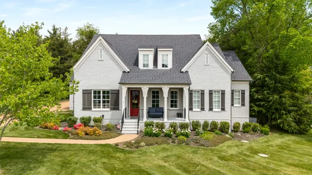a kitchen with stainless steel appliances granite countertop a sink a stove and cabinets