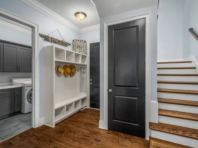 a wooden bench with some trees