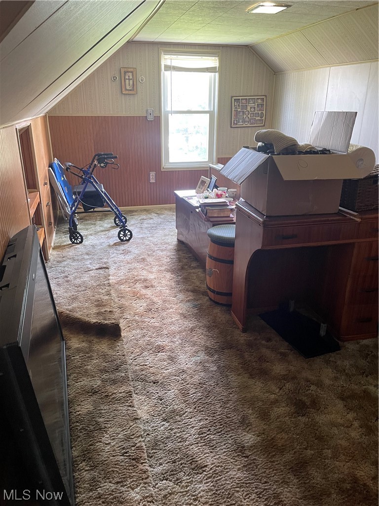11610 Crofton Road Garfield Heights, OH 44125 - Photo 13 of 19 Bedroom with wooden walls, dark carpet, and vaulted ceiling