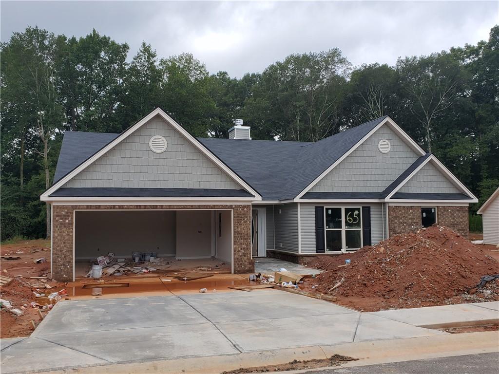 902 River Mist Circle Jefferson, GA 30549 - Photo 1 of 1 a view of a yard in front of a house with large windows