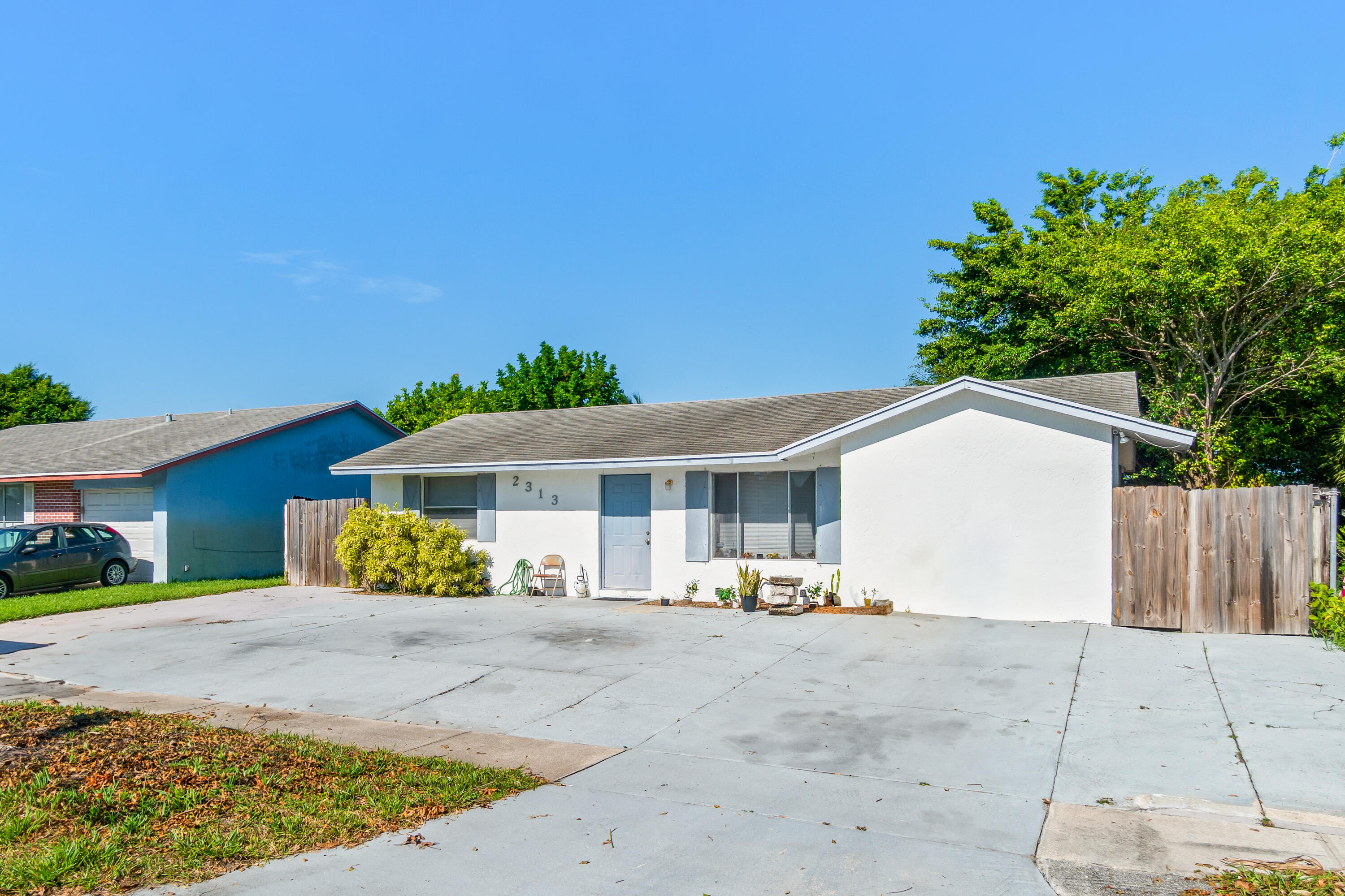 2313 Z Terrace Riviera Beach, FL 33404 - Photo 2 of 21 a front view of a house with a patio