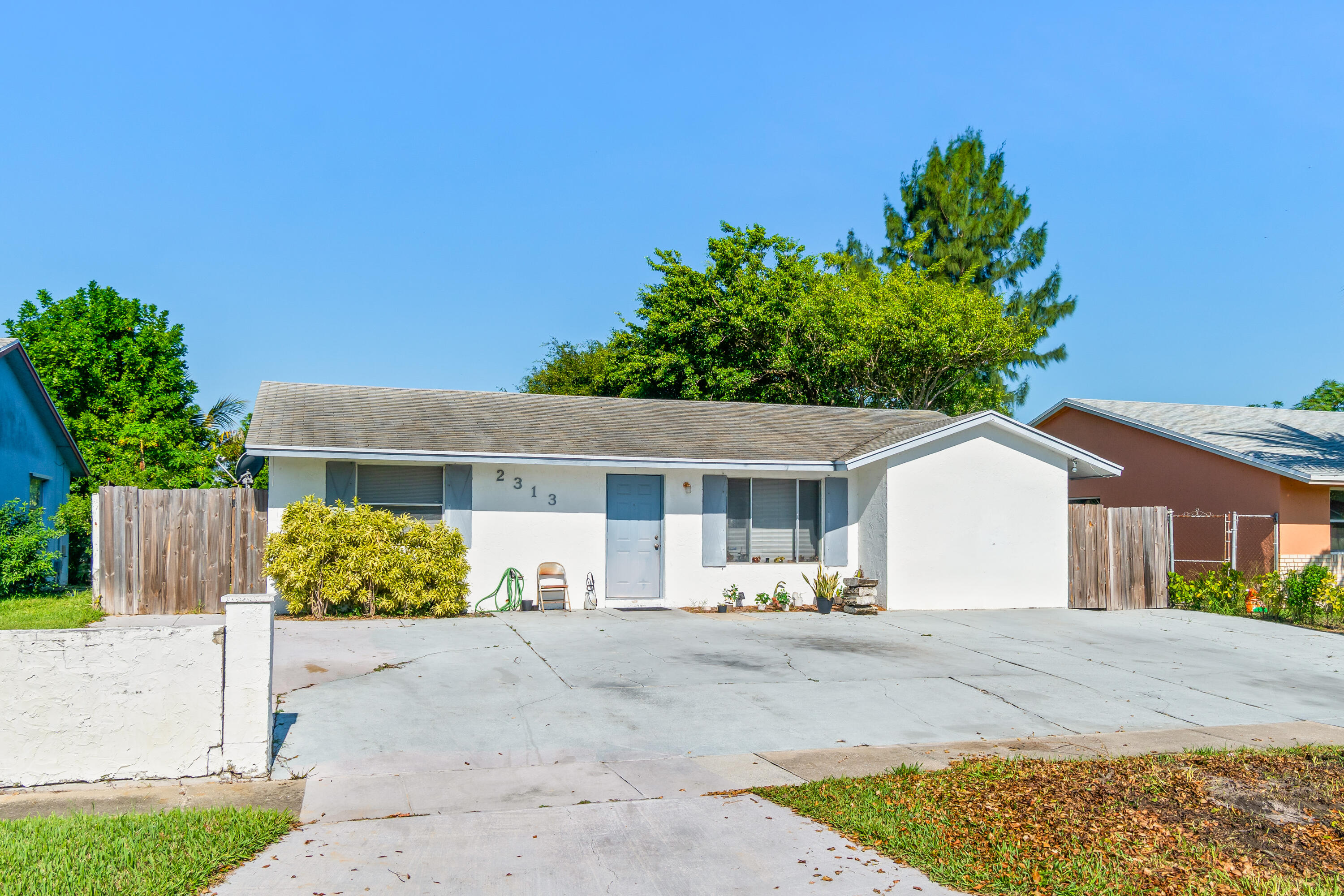 2313 Z Terrace Riviera Beach, FL 33404 - Photo 3 of 21 a view of a house with a yard and plants