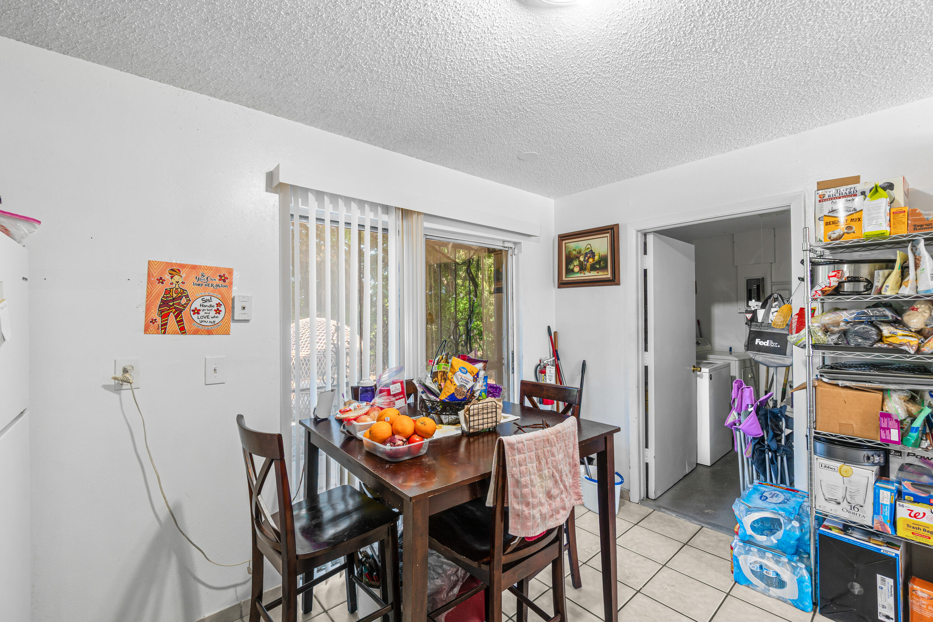 2313 Z Terrace Riviera Beach, FL 33404 - Photo 10 of 21 a view of a dining room with furniture and a window