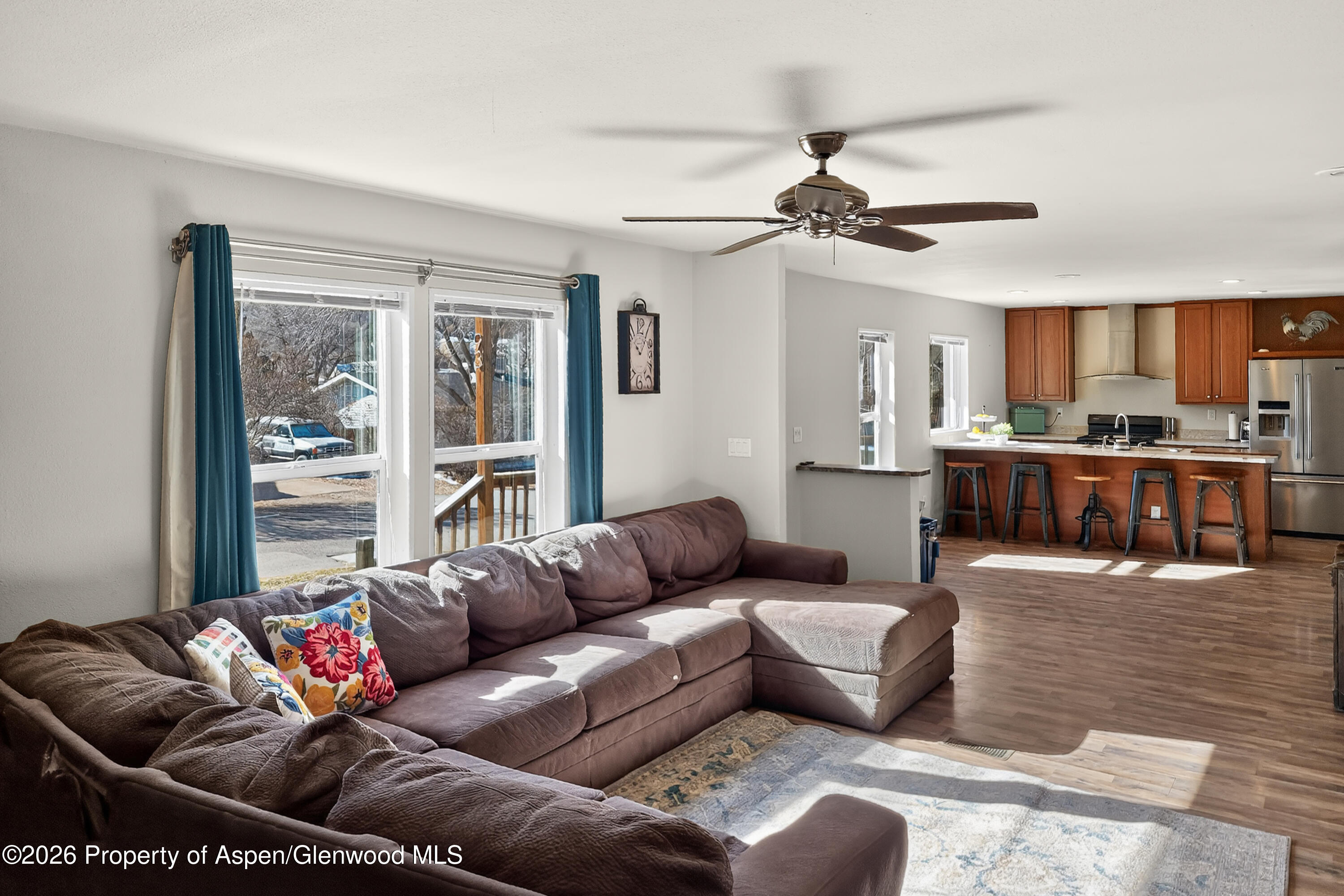 93 Remington Street Rifle, CO 81650 - Photo 11 of 25 a living room with furniture and a large window