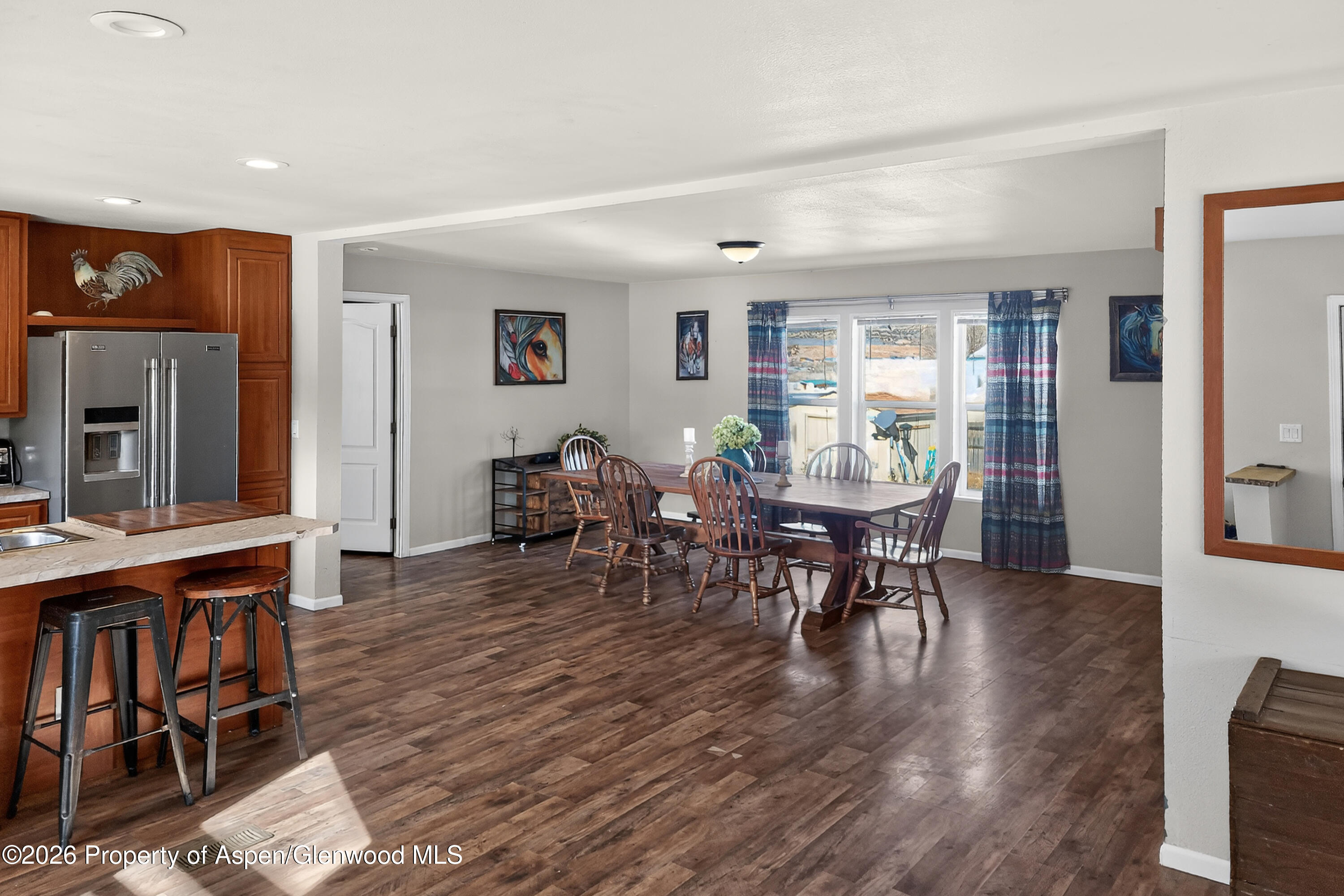 93 Remington Street Rifle, CO 81650 - Photo 2 of 25 a view of a dining room with furniture and wooden floor