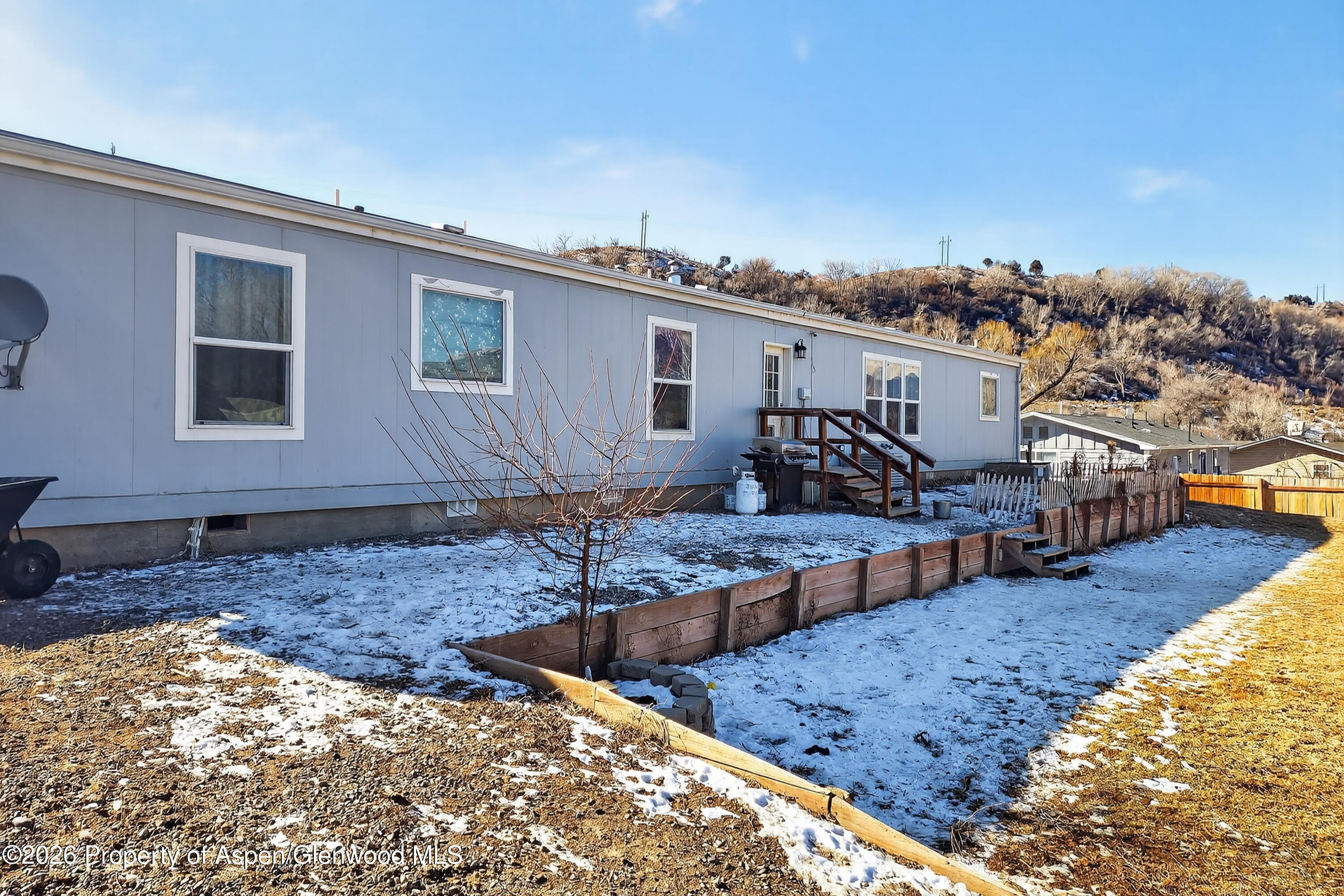 93 Remington Street Rifle, CO 81650 - Photo 25 of 25 a view of house with yard and sitting area