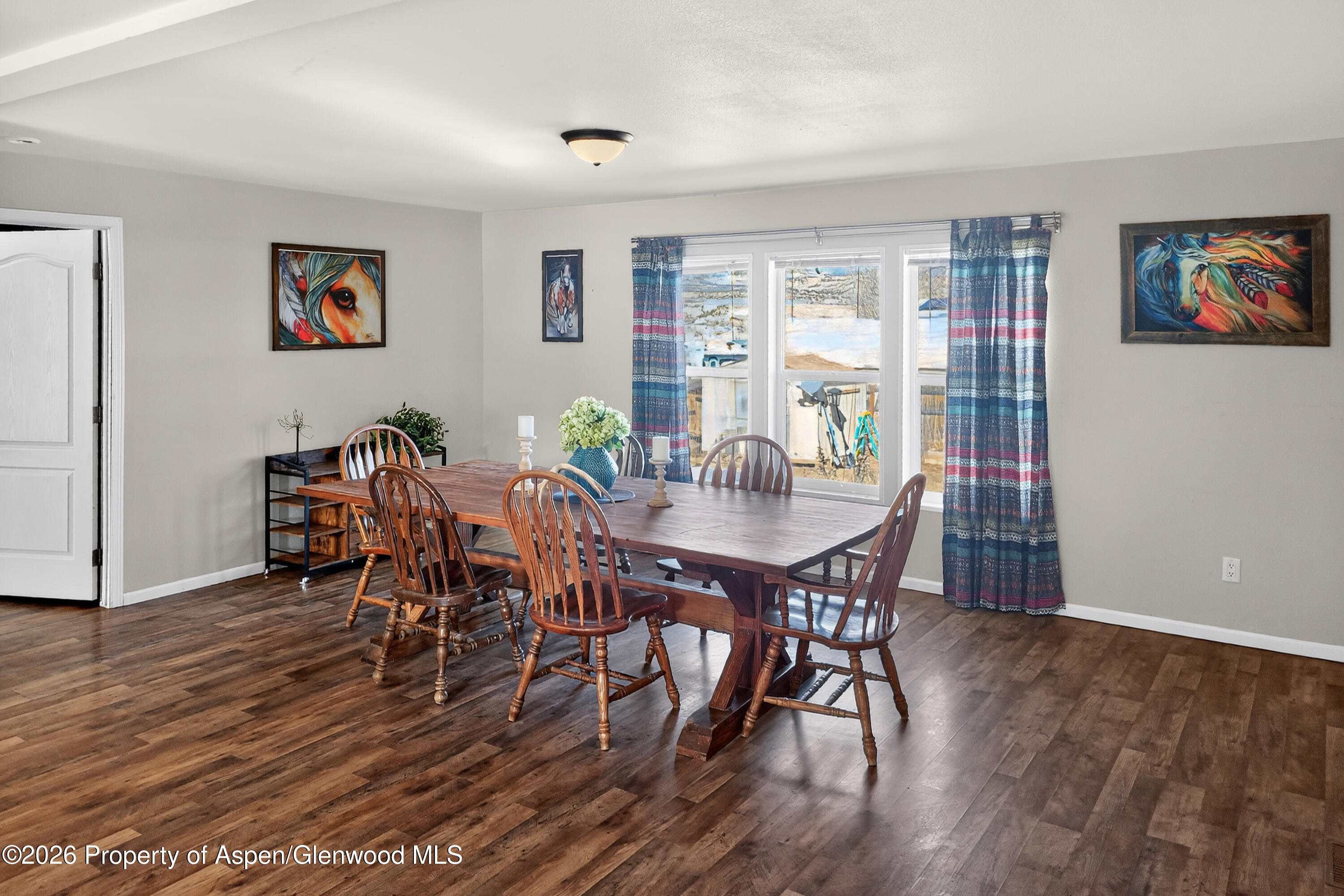 93 Remington Street Rifle, CO 81650 - Photo 6 of 25 a view of a dining room with furniture window and wooden floor