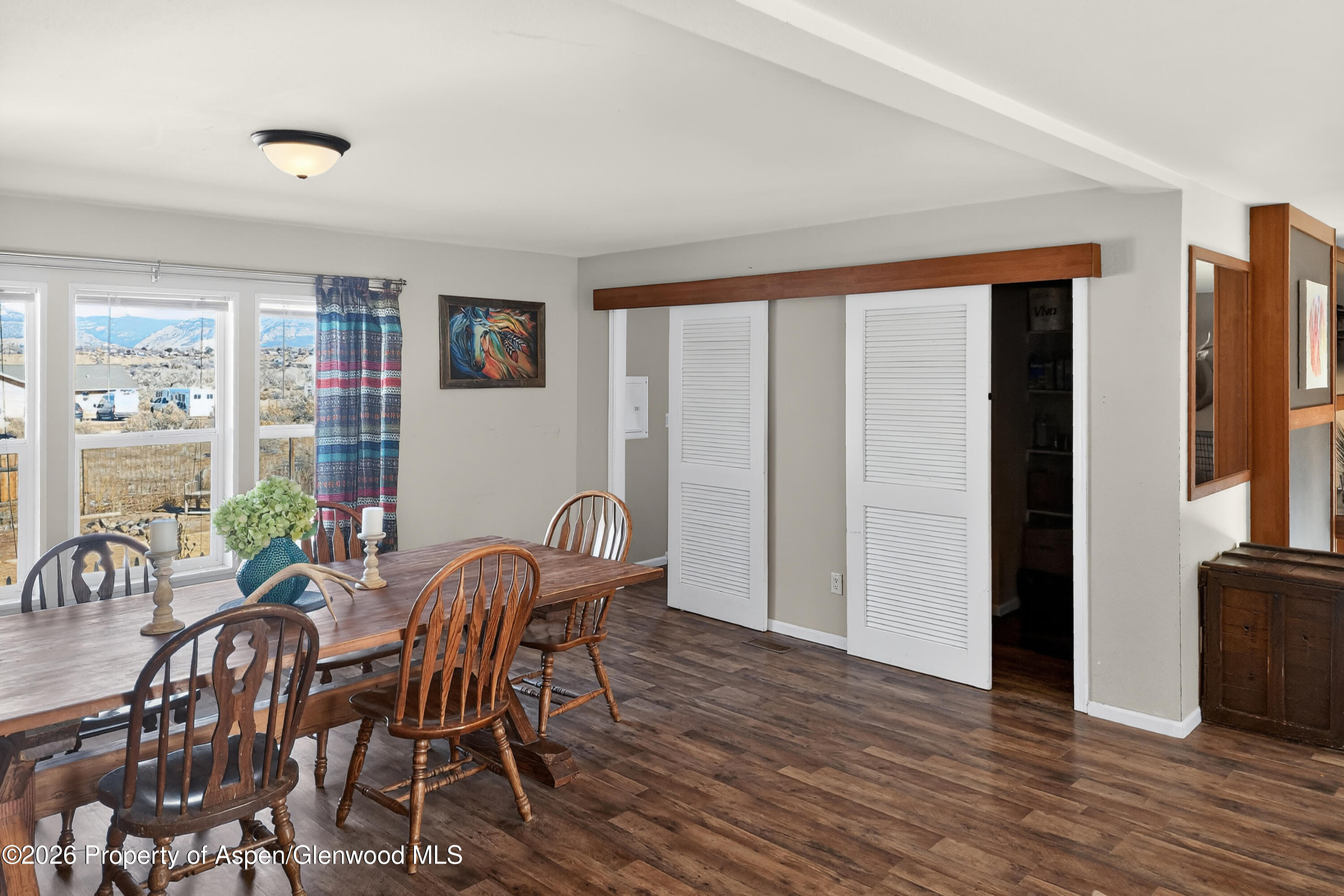 93 Remington Street Rifle, CO 81650 - Photo 7 of 25 a view of a dining room with furniture window and wooden floor