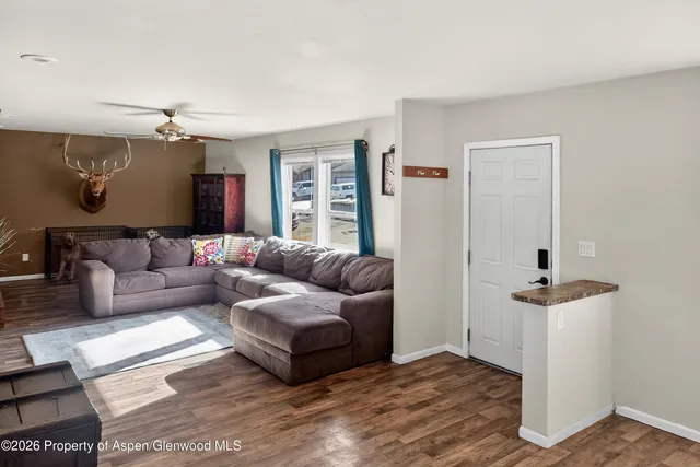 a living room with furniture and a flat screen tv