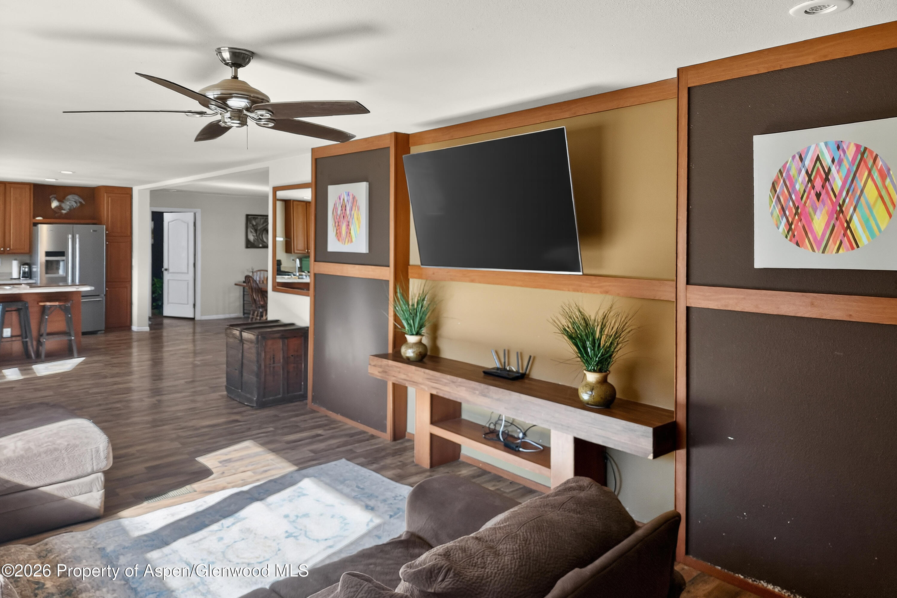 93 Remington Street Rifle, CO 81650 - Photo 10 of 25 a living room with furniture and a flat screen tv