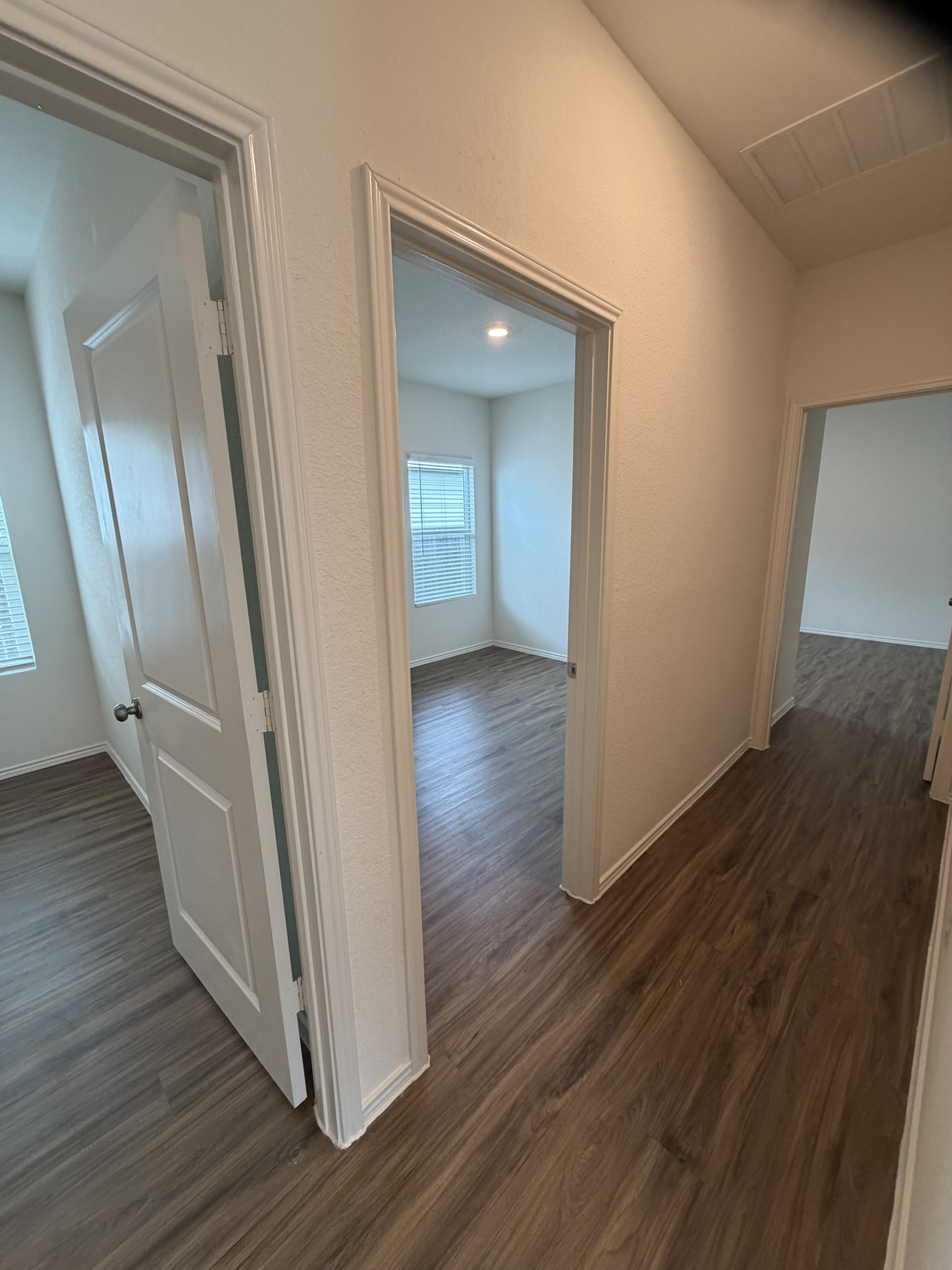 408 Buckners Street Georgetown, TX 78626 - Photo 6 of 15 a view of a hallway with wooden floor