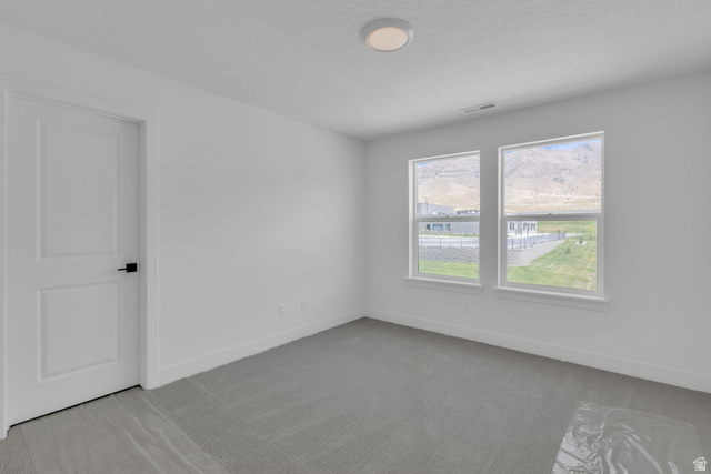2821 Scarlet Road, Unit 149 Eagle Mountain, UT 84005 - Photo 16 of 28 Bright bedroom and a large window offering expansive outdoor scenery.