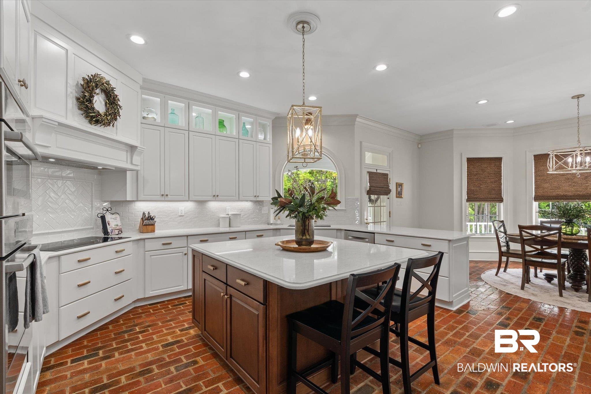 8561 Dawes Lake Road Mobile, AL 36619 - Photo 8 of 63 Kitchen featuring a peninsula, light countertops, brick floors, recessed lighting, and white cabinetry