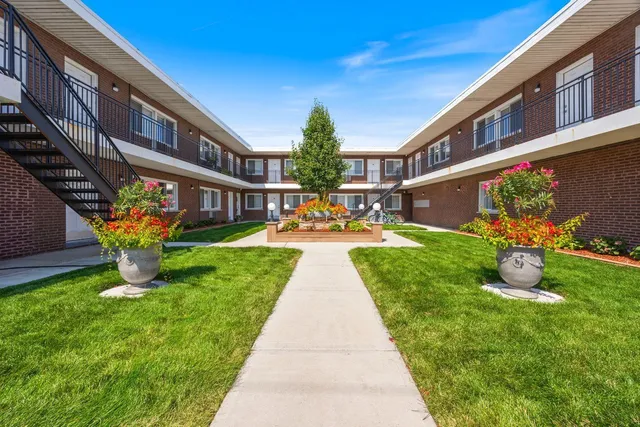 a view of an front of house with an outdoor seating
