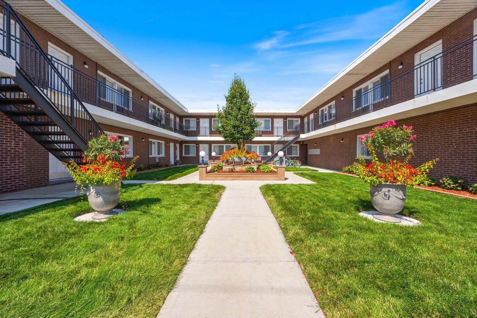 a view of an front of house with an outdoor seating