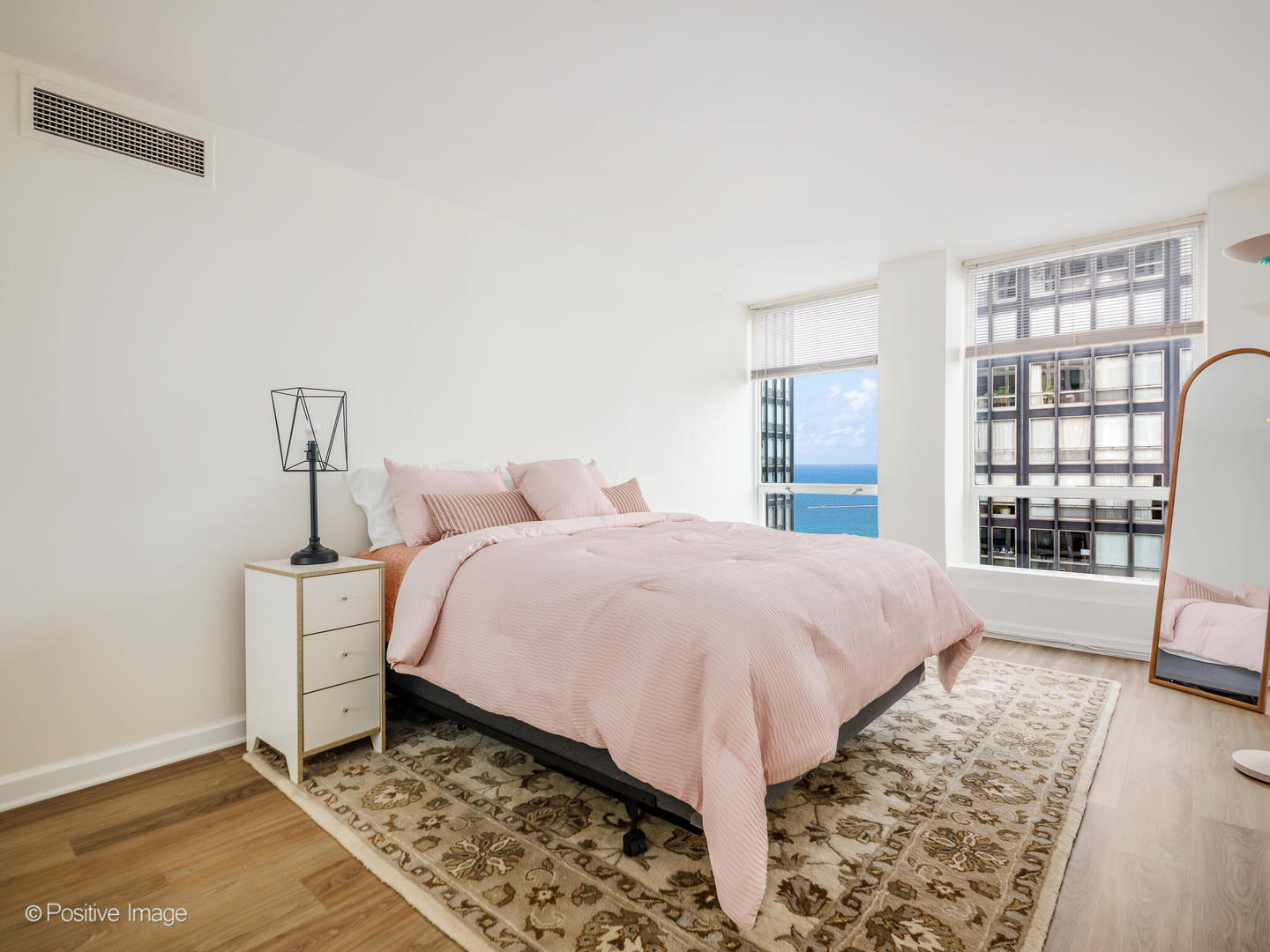 260 East Chestnut Street, Unit 2507 Chicago, IL 60611 - Photo 11 of 22 a spacious bedroom with a bed and a window