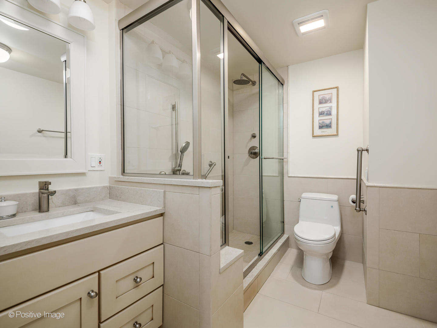 260 East Chestnut Street, Unit 2507 Chicago, IL 60611 - Photo 16 of 22 a bathroom with a sink toilet and shower