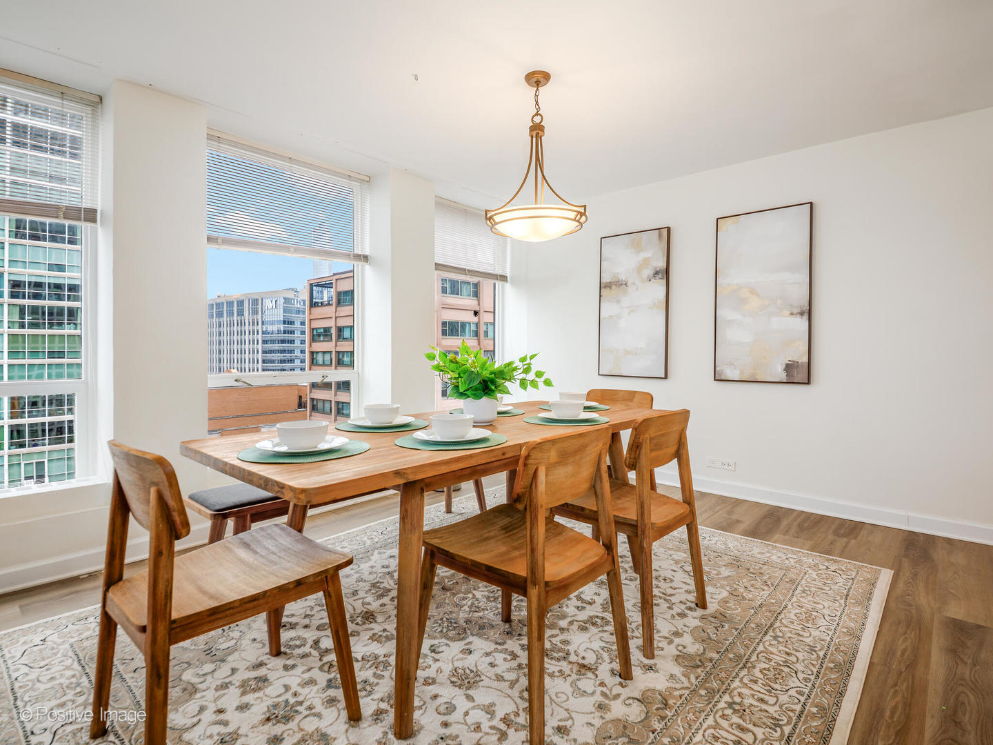 260 East Chestnut Street, Unit 2507 Chicago, IL 60611 - Photo 6 of 22 a view of a dining room with furniture window and wooden floor